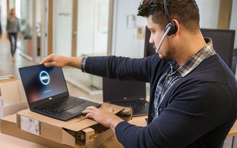 Dell IT technician using laptop