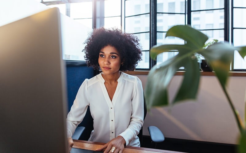 Businesswoman on desktop computer in office