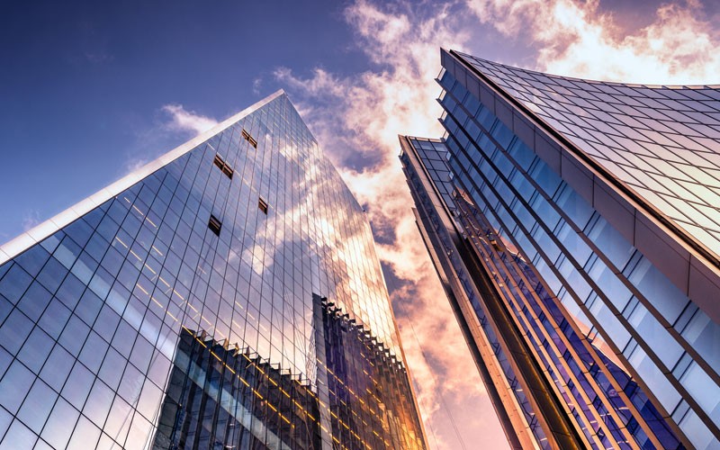 looking-up-to-cloudy-sky-with-skyscrapers