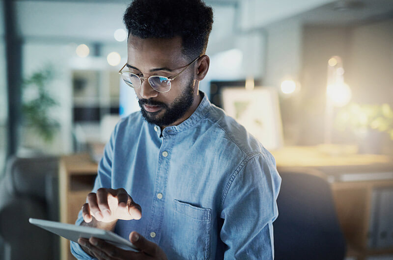 Business professional reviewing regulatory compliance information on computer