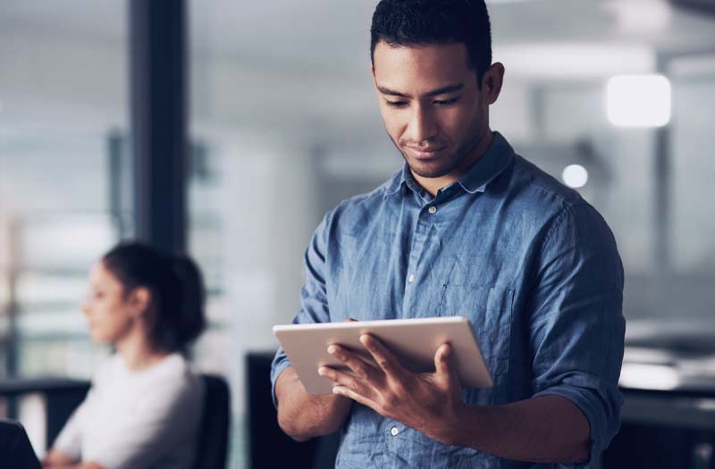 Man using tablet device in office